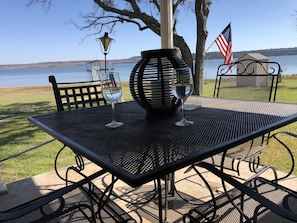 Enjoy a glass of wine on the porch while the kids play in the yard. 