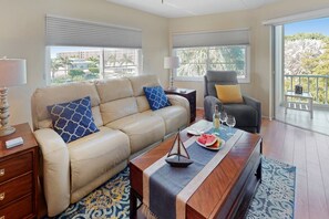 Lovely living room area that opens out to the screened lanai.  Both the leather sofa and chairs have reclining options!