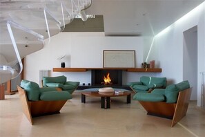  Living Room offers a Fireplace and Repose