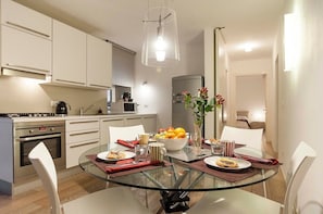Modern Kitchen with All Appliances and Dining