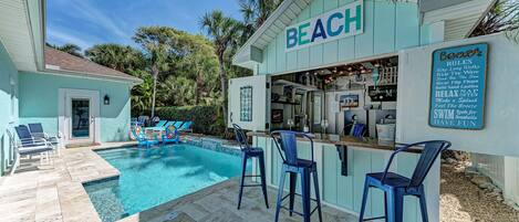 Beautiful backyard with pool and tiki bar