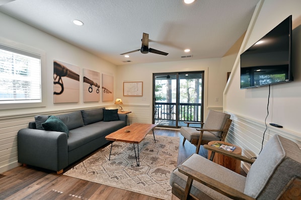 Living area with lake views and sofa sleeper.