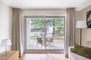 Enjoy your morning coffee or a glass of wine on your private patio overlooking a peaceful green space.