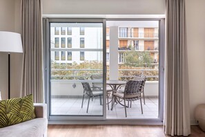 Enjoy fresh air and serene views from your private balcony, complete with outdoor seating for quiet mornings or evenings.