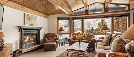 The view of the surrounding mountains through the large windows in the home are amazing any time of year.