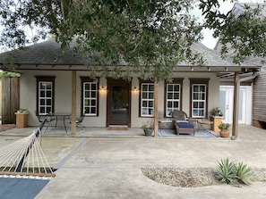 Back entrance to Little Crawfish suite overlooking pool and Bayou