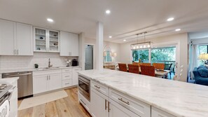 Kitchen Opens to Dining and Living Areas