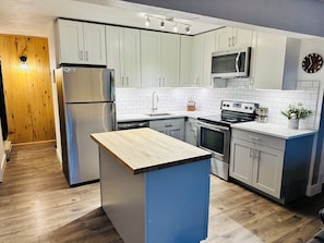Updated kitchen , butcher block countertop , stainless steel appliances