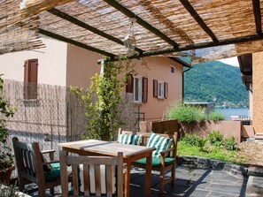 Plant, Table, Building, Property, Furniture, Window, Chair, Wood, Outdoor Table, Shade