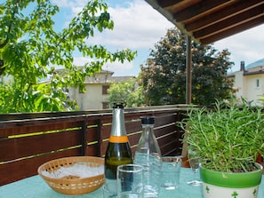 Sky, Plant, Bottle, Drinkware, Cloud, Tableware, Tree, Table, Barware, Window