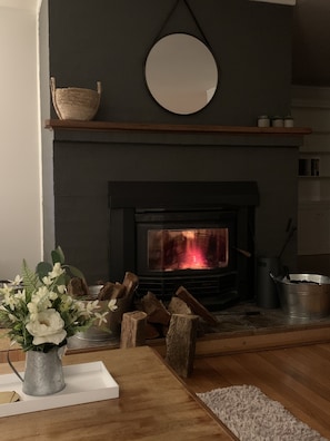 Keep warm and toasty with a glass of wine 🍷 in front of the fire