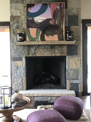 Large, double-sided stone fireplace