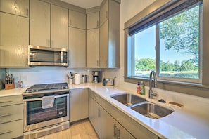 Prepare meals in the fully equipped kitchen.