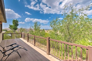 Bask in the sun outside on the deck of this vacation rental.