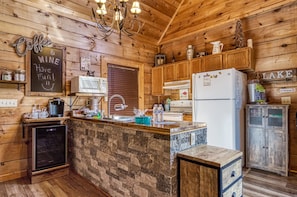 Pet Friendly Pigeon Forge Cabin - Baby Bear Cabin - Fully furnished kitchen with wine fridge