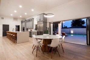 Let's make your dreams come true! 🤩 This 16' kitchen island with quartz waterfall countertops and 12' bifolding Nanawall leading to a private backyard oasis will bring peace of mind and luxury living! Can you imagine it? 🤔 #dreamhome #luxuryliving