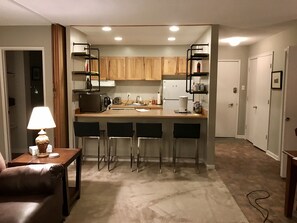 There’s a small but efficient kitchen with stove/oven/dishwasher/microwave.