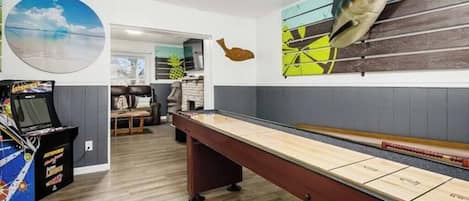 First floor gaming room includes Skeeball, shuffleboard, arcade games and board games.