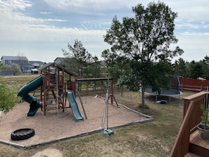 Play area, tetherball, 16x20 deck, seating, no longer a trampoline.