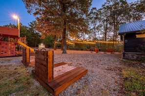 Horseshoe pits, fire pit with seating, and a play set for the kiddos.