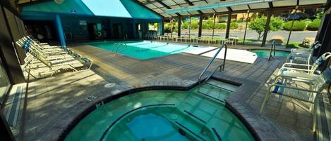 Indoor and outdoor swimming pool, hot tub and poolside loungers