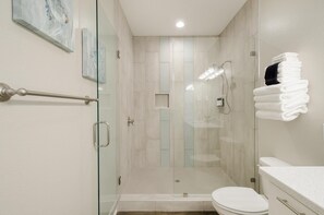 Luxurious primary bath with walk-in shower and Quartz counter tops.