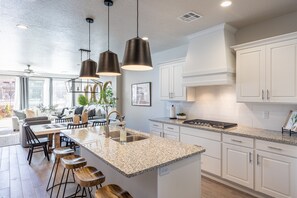 Kitchen Island - The Kitchen Island comfortably seats 4 adults and creates a great space for serving and preparing meals.