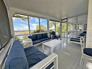 Relax in the screened porch, perfect for quiet mornings or evenings.