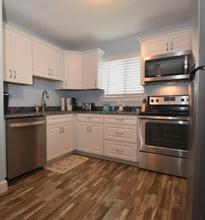 Kitchen has a coffee pot & Keurig, toaster, wine cooler, blender, crockpot, etc.