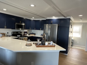 Renovated Kitchen with Cambria countertops & a large counter height sitting area