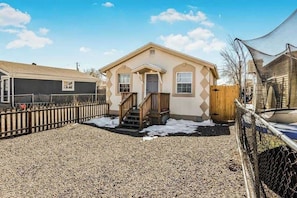 A beautifully maintained exterior and a welcoming front porch.