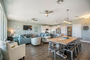 Open Living/Dining/Kitchen with beach/ocean views.