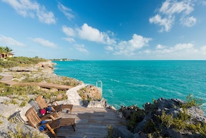 Views from the rocks by seating area overlooking the ocean.