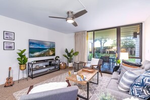 Unwind in our stylish living room with garden views, modern decor, and all the comforts of home.