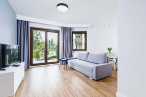 Living room with a comfortable sofa and TV. 