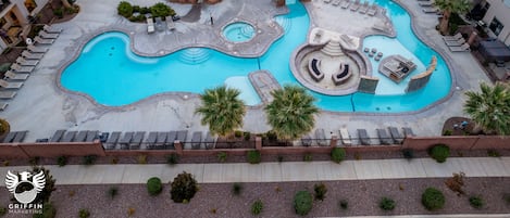 Bird's eye view of clubhouse pool, lazy river, hot tub, splash pad and fire pit