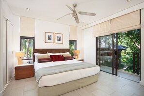 The primary suite is set with a comfortable king bed with a cooling breeze from the ceiling fan and central air-conditioning.