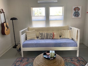 Living room with door to front porch