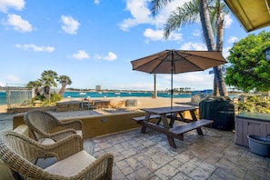 Sit on this patio and enjoy the sights or grab the included beach chairs and kick-it on the beach with your feet in the water.