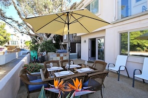 Enjoy eating your meals outdoors on the patio. Table comfortably seats six and has an umbrella to provide shade. 