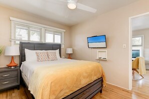 Master bedroom with a queen size super comfy bed has it's own TV. 