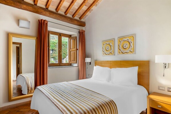Restful slumber awaits in this snug bedroom, where comfort and simplicity are key.