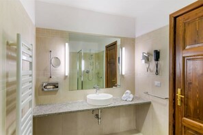 A clean, well-lit bathroom with modern amenities, offering a fresh start to the day.