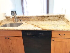 Kitchen with granite counter tops and custom made cabinets. New dish washer.