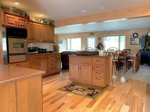 Kitchen opens to dining area