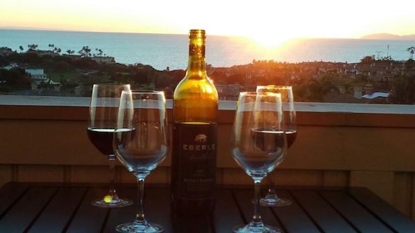 Relax with your favorite beverage as the sun sets behind Catalina Island.