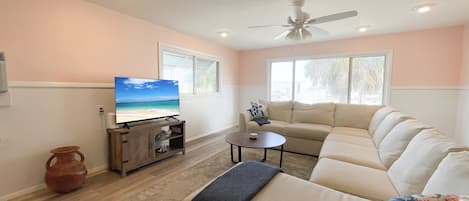 living room with a sectional and television