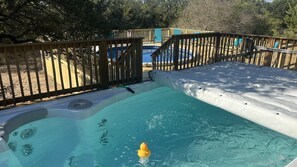 When you get done swimming in the spa walk down the stairs and enjoy the pool.