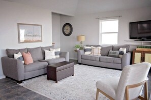 The cozy living room is an ideal space to unwind with friends and family 