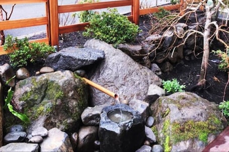 Zen rock garden at front of home. Please park on the curb alongside this garden.